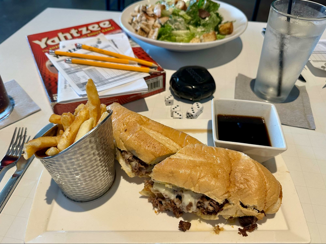 Steak sandwich and fries at Nerdvana, a casual game-theme restaurant in Frisco, Texas.