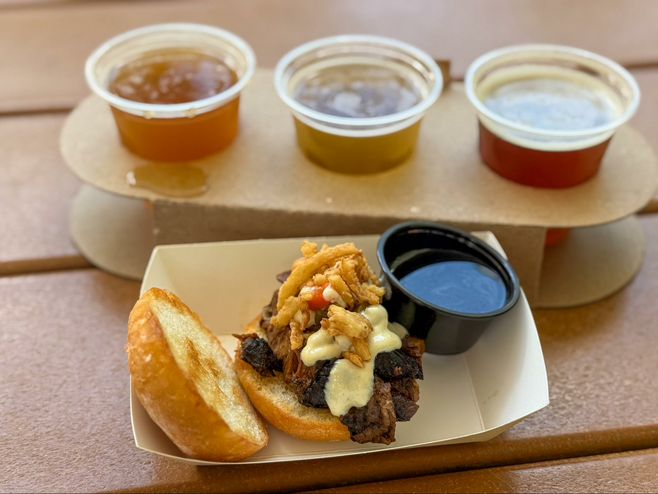 beef sandwich with three beers
