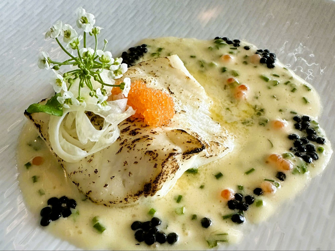 Turbot fish served with caviar and capers.