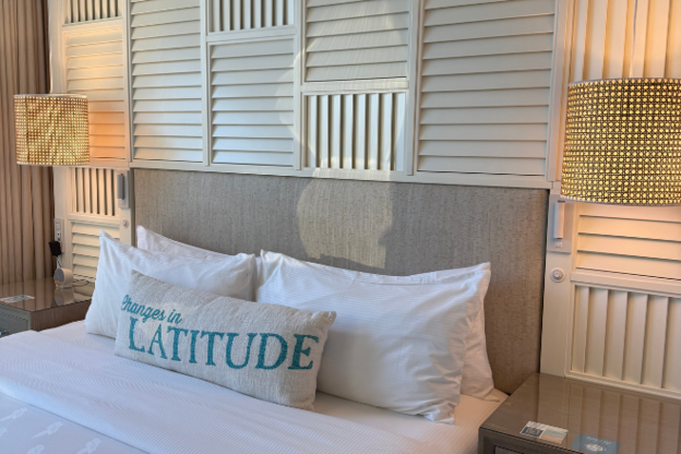 Coastal-inspired style king bed with bright colors and beachy touches.