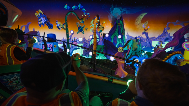 Guests riding Buzz Lightyear's Space Ranger Spin ride at Disney World