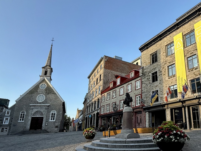 Place Royale with Notre-Dame-des-Victoires, featuring period stone architecture, an historic spot in Old Quebec.