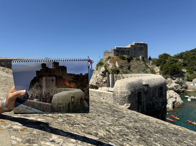 Old Dubrovnik, medieval fortress, Fort Lovrijenacon, on a hill with Game of Thrones scene card in foreground.