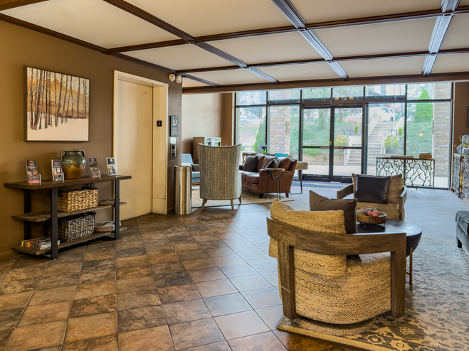 Lobby of Meadowbrook Inn in Blowing Rock, North Carolina, with cozy seating and mountain-inspired décor.