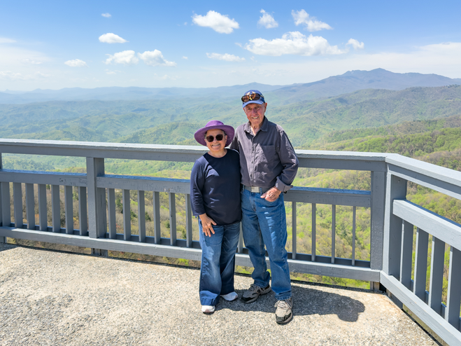 Author and husband at Blowing Rock Observation Deck with Blue Ridge Mountain views