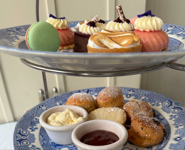 blue plates holding cakes and scones