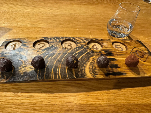 Five chocolates and an empty whiskey dram