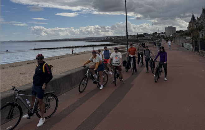 Bikers on the boardwalk, part of bike tour