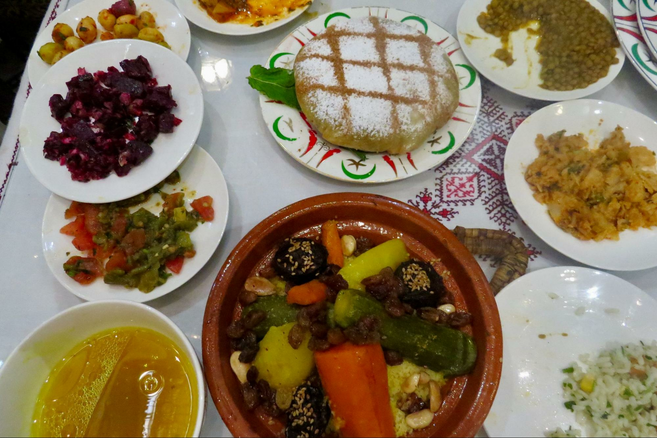 A colorful assortment of Moroccan food on a table,