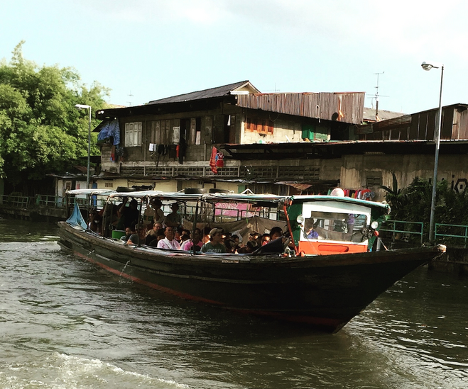 Wooden canal boat filled with commuters