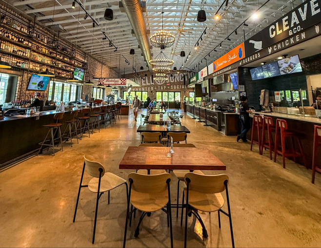 Empty Atlanta food hall with seating down the center