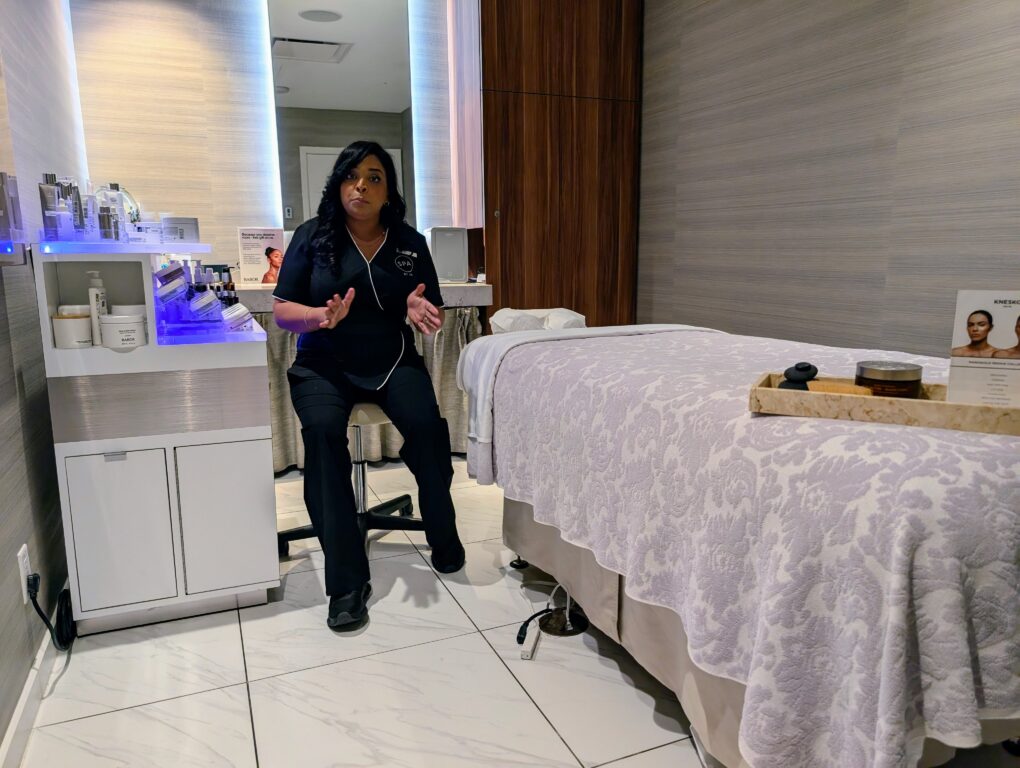Massage therapist in a treatment room at the JW Spa in the JW Marriott Parq Vancouver