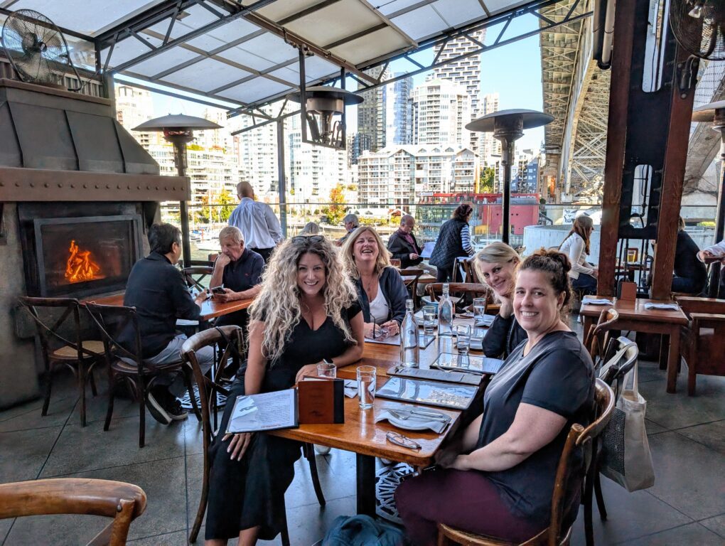 4 women having lunch at The Sandbar restaurant on Granville Island, near Vancouver.
