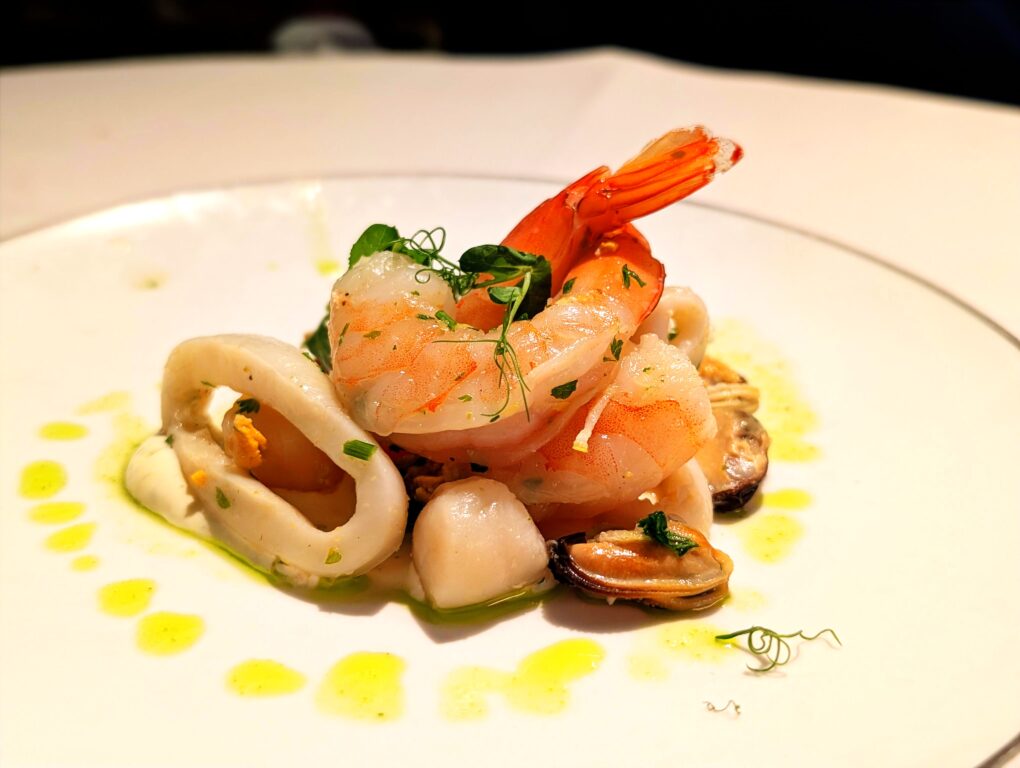 herb and citrus marinated seafood salad in the Top Sail Restaurant in MSC Seascape's Yacht Club.