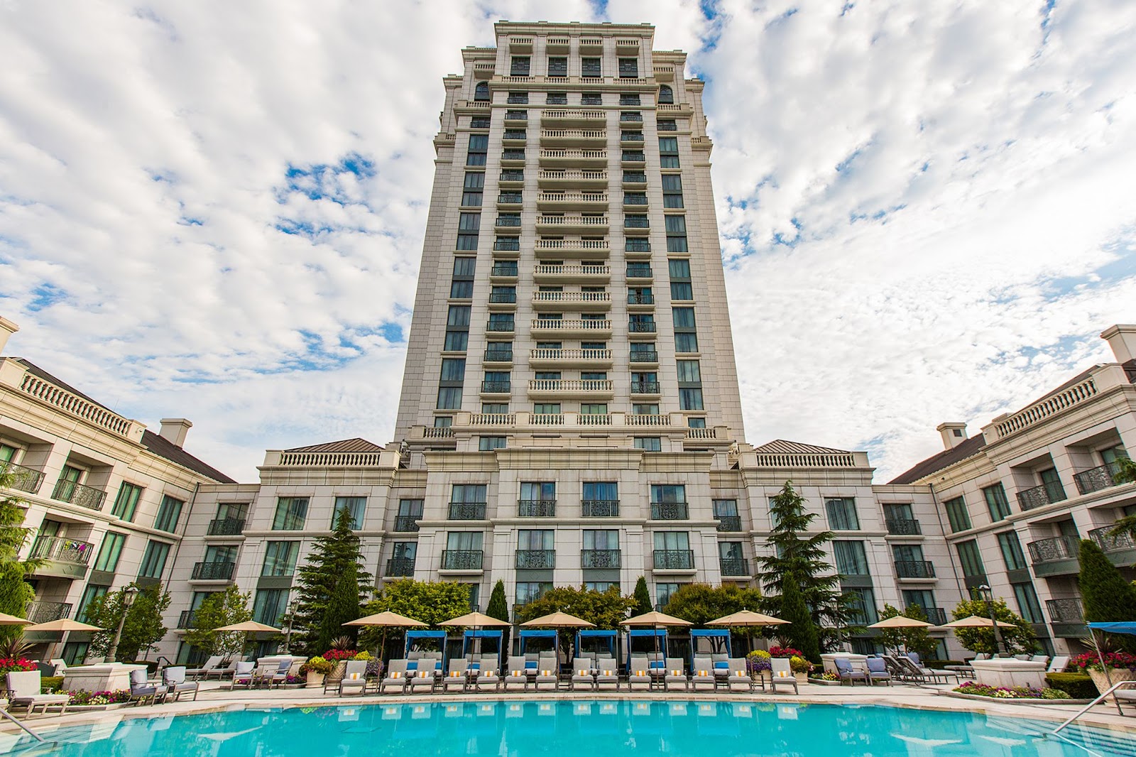 The Grand America Hotel exterior in Salt Lake City with a an outdoor pool