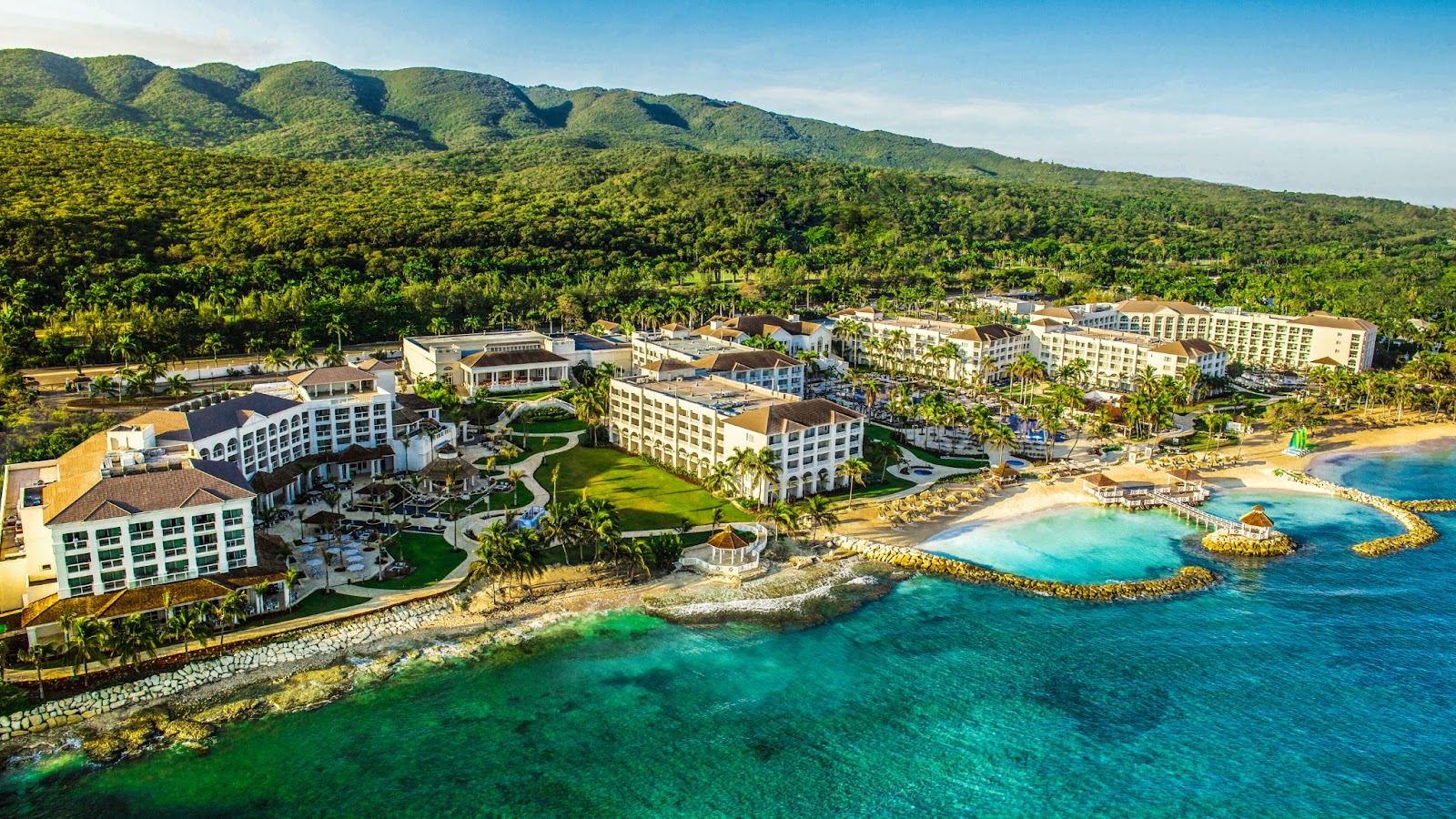 blue ocean water and white resort buildings at Hyatt Zilara Rose Hall adults-only all-inclusive resort