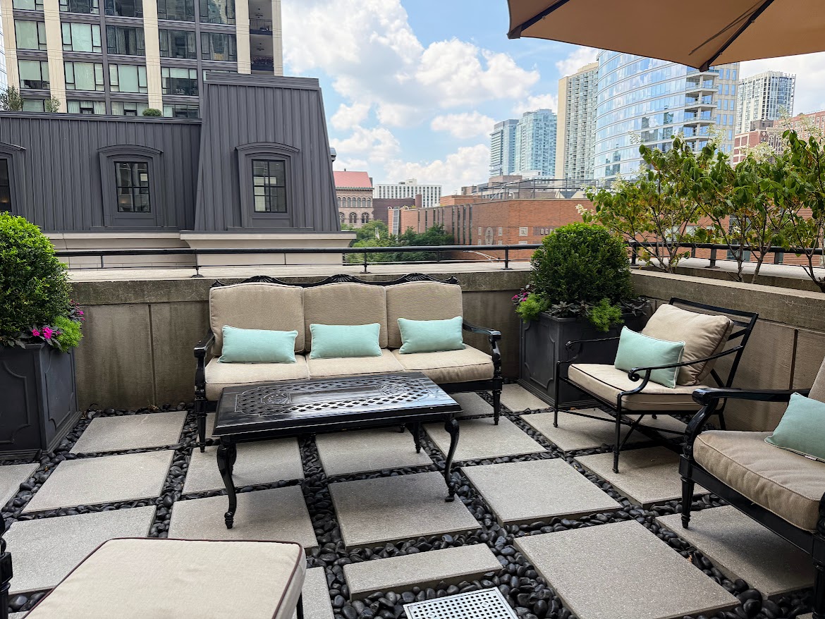 The spa deck at The Waldorf Astoria Chicago with city skyline views is a relaxing escape for spa guests.