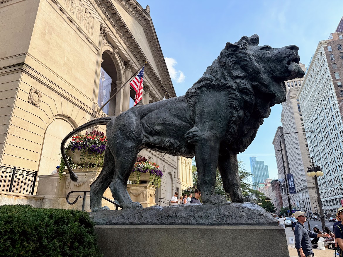 A lion statue greets visitors to The Art Institute of Chicago's front entrance.