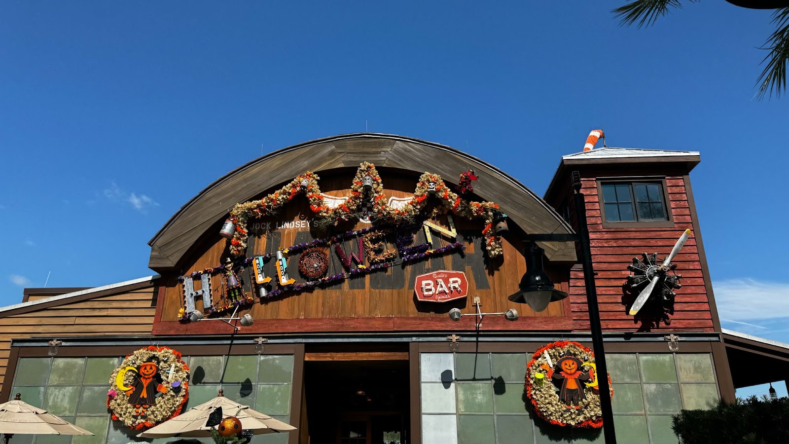 Fall decorations and wreaths on the outside of Halloween bar in Orlando, Jock Lindsey's Halloween Hangar Bar