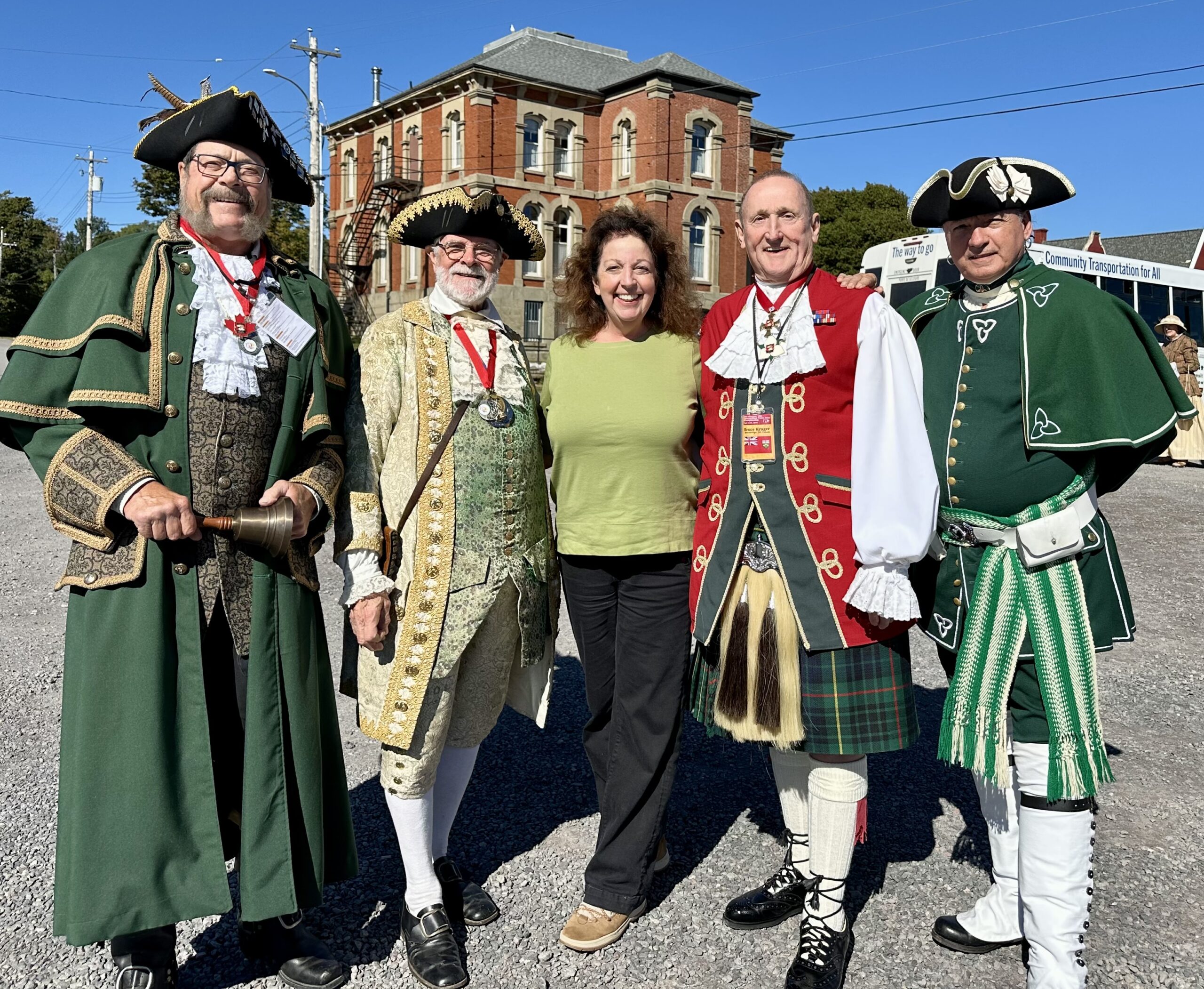Woman with town criers in period costumes in Pictou, Nova Scotia.