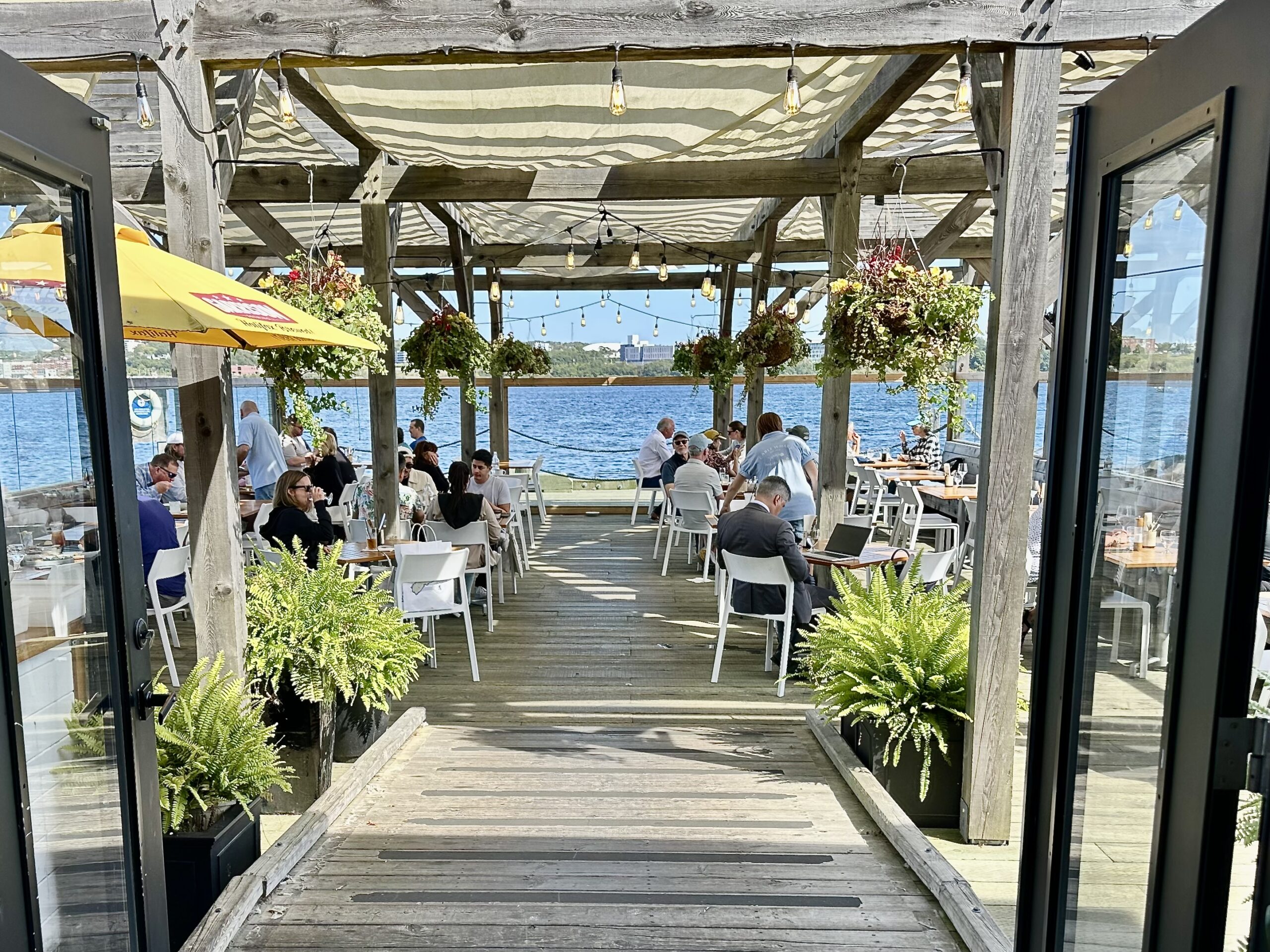 Outdoor dining at the Cable Wharf in Halifax, a Nova Scotia Chowder Trail stop.