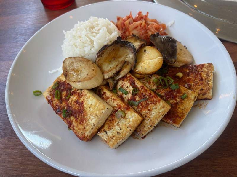 Tofu, oyster mushrooms, rice and kimchi dish