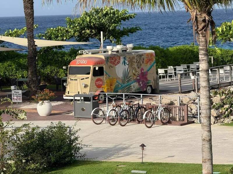 Food truck near the ocean with bicycles in front of it