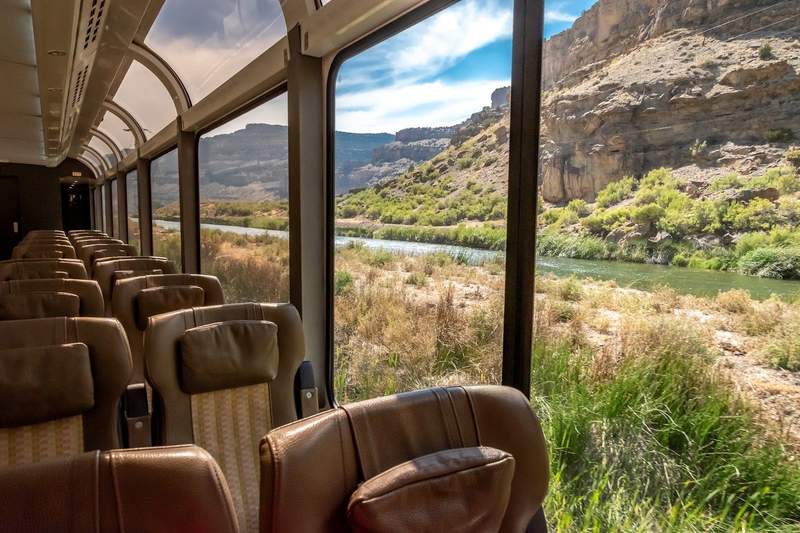 Train cars on the Canyon Spirit have large panoramic windows and comfortable, reclining leather seats.