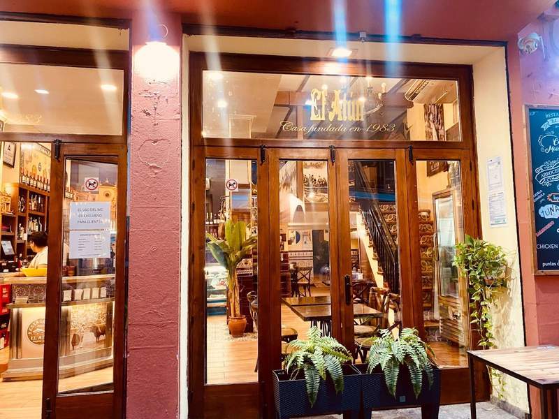 outside of a restaurant, with wide windows and doors