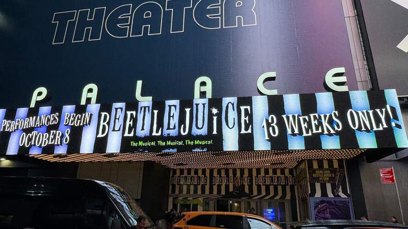 Beetlejuice marquee at the Palace Theater with black and white text.
