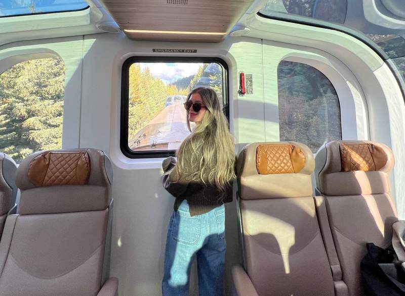 The Rocky Mountaineer's glass dome car in GoldLeaf service offers panoramic views of the surrounding foliage and scenery.