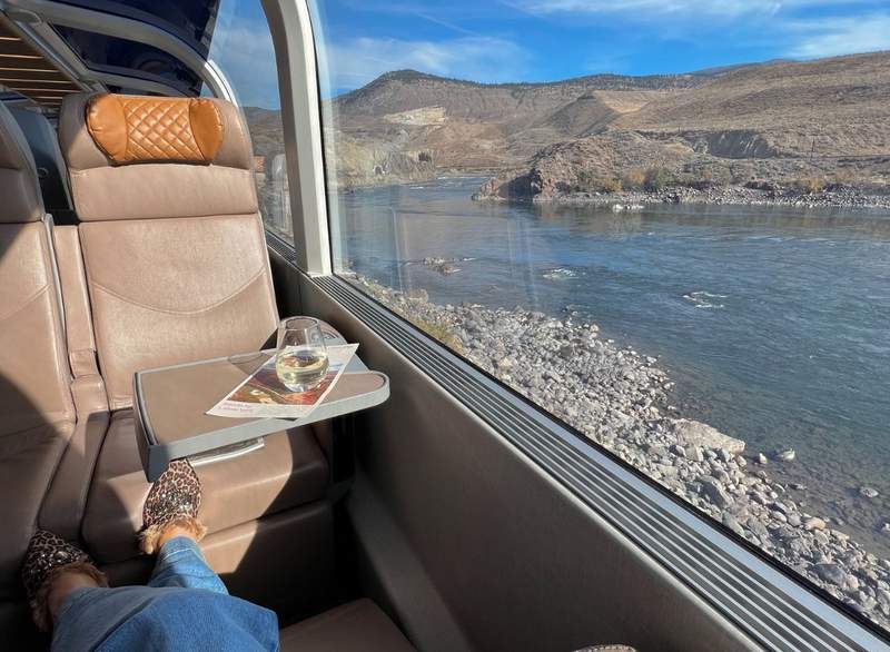 The Rocky Mountaineer's GoldLeaf service offers a glass dome upper level with spacious seating and reclining leather chairs.