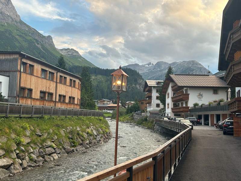 The Lech River runs through the village with the Austrian Alps as a backdrop.