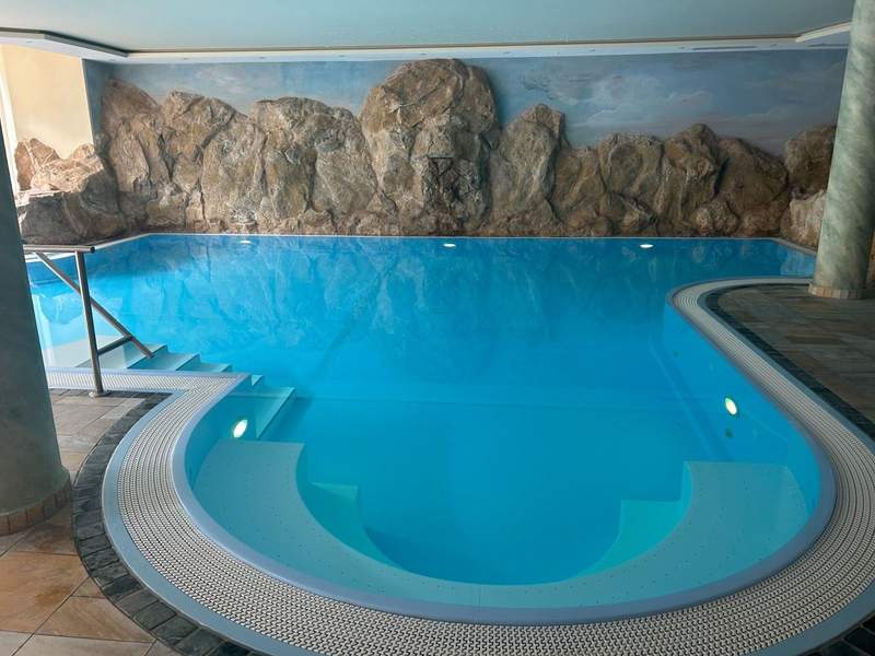 A relaxing indoor pool that is part of  the wellness center at the Hotel Alte Post in St. Anton am Arlberg. 