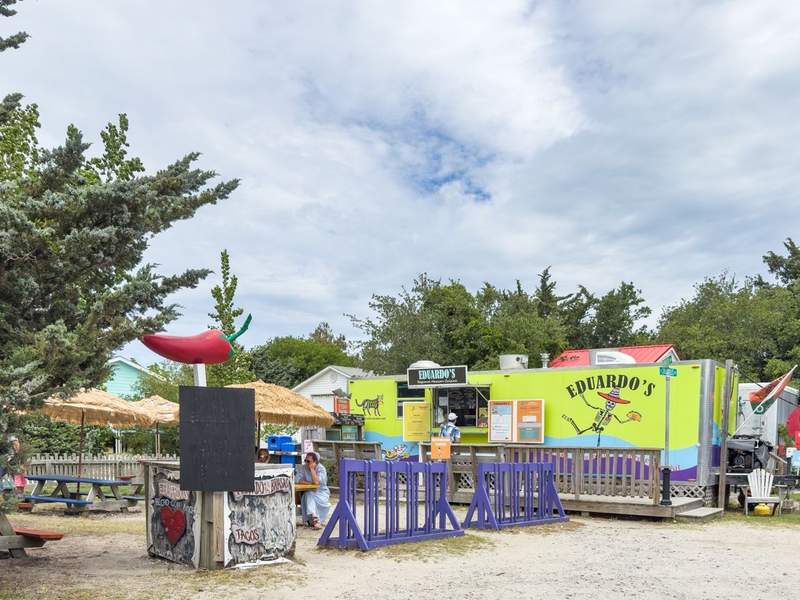 Ocracoke food truck run by Chef Eduardo Chavez; menu board highlights seafood tacos, burrito bowls, and house salsas.