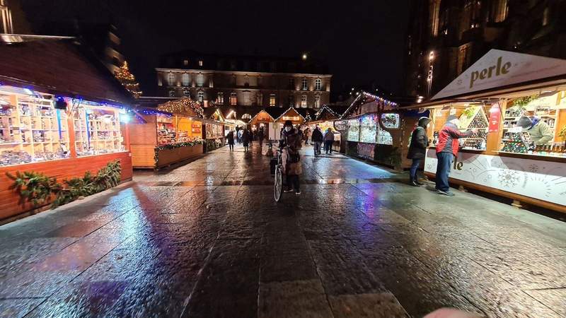 Christmas market stalls lit up at night 