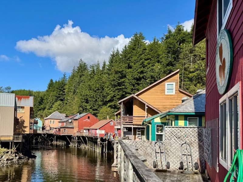 Colorful historic buildings on both sides of Ketchikan Creek.
