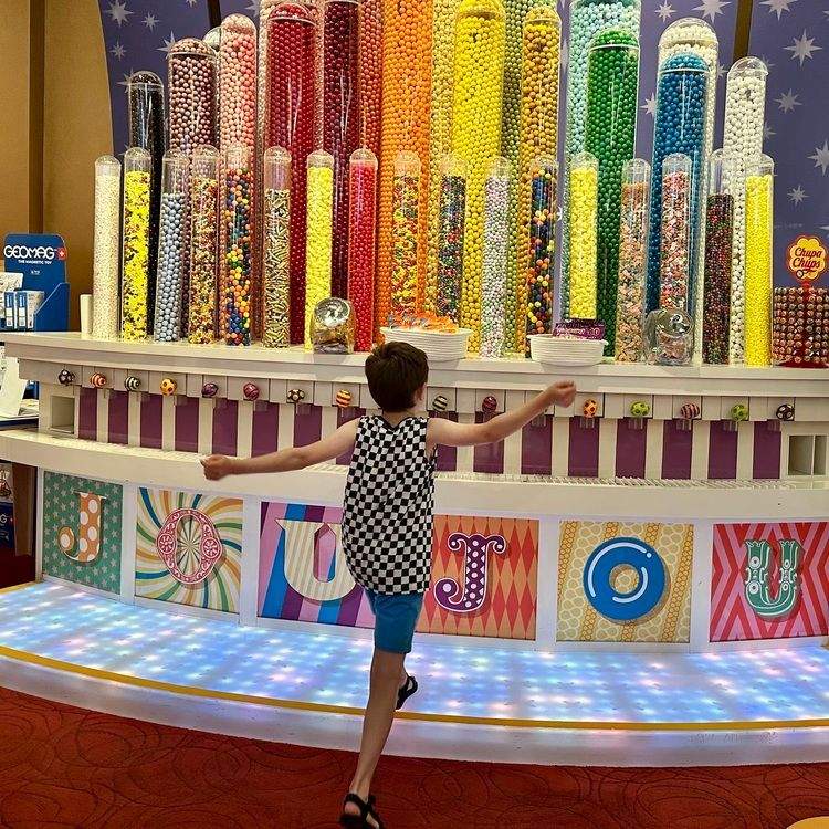 Boy at candy display.