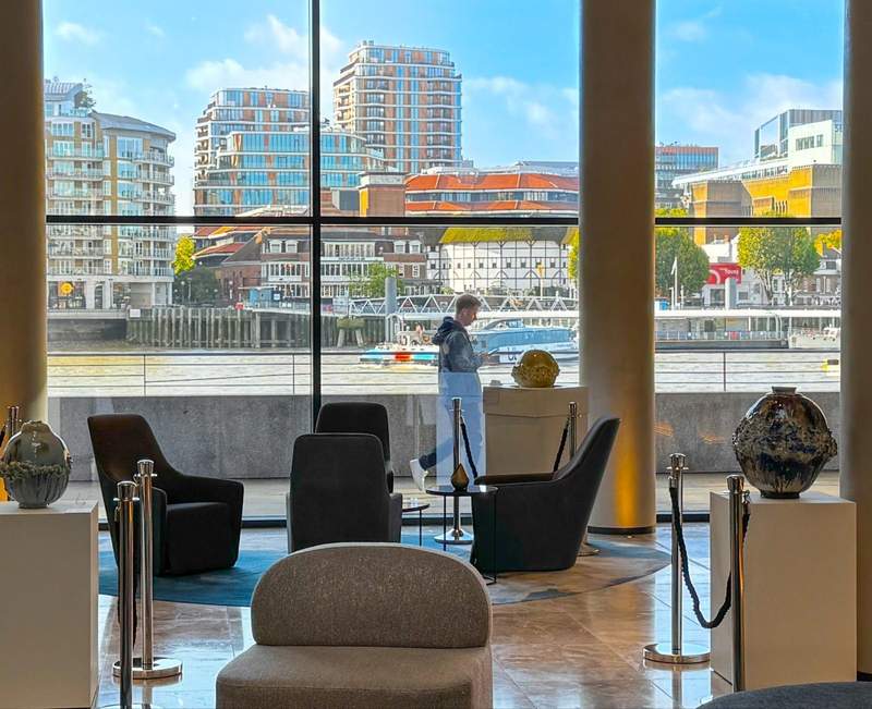 The ground floor lobby of The Westin London City has a stunning view across the Thames River toward Shakespeare's Globe theatre and other Bankside attractions.