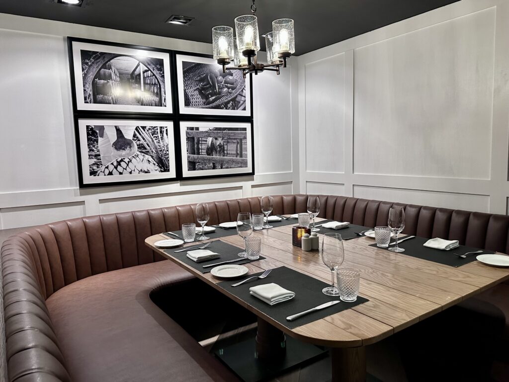 Red leather booth at JWB Steakhouse, a restaurant at Margaritaville Island Reserve Riviera Maya