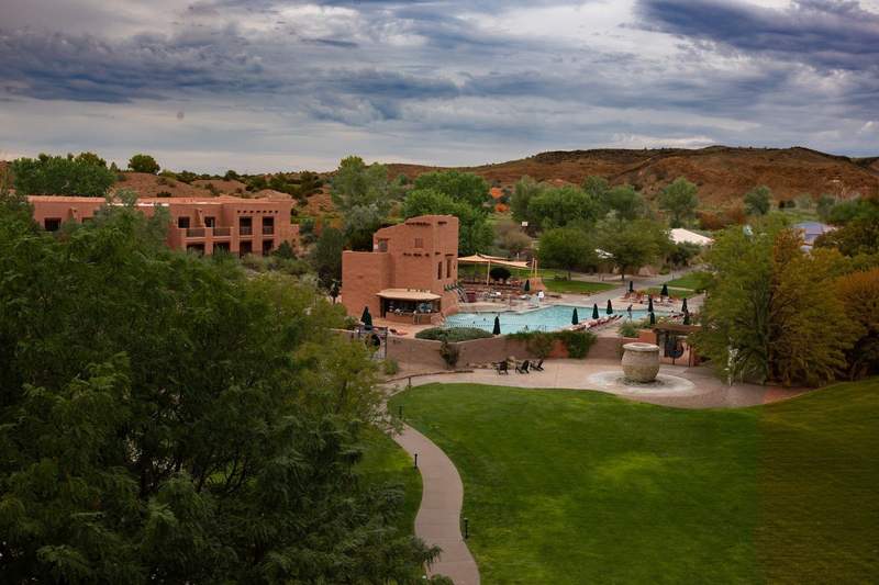 A three-story waterslide in the tall building to the left of the pool, empties into the family oriented Plaza Pool