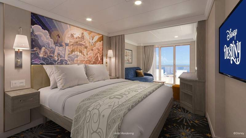 Cruise ship state room with bed and verandah