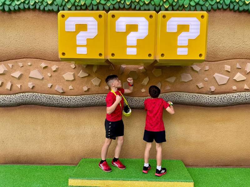 Kids playing in a Nintendo-themed land