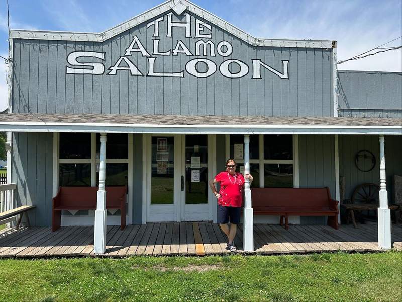 The author in front of the Alamo Saloon in Old Abilene Town.
