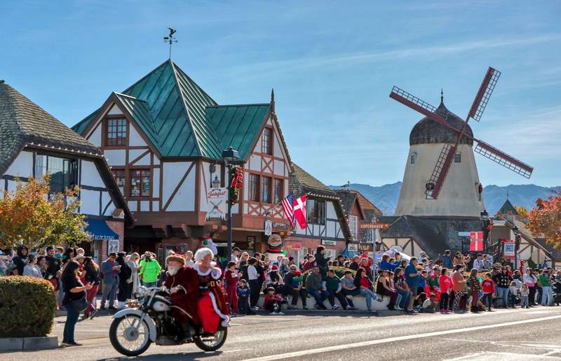 Mr and Mrs Claus on a motorcycle in the center of Solvang.