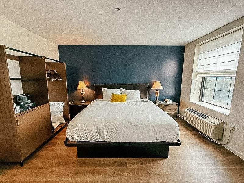 view of bed from king room at Landmark Inn Marquette MI