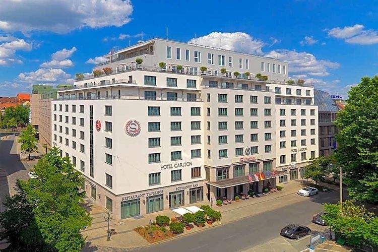 Exterior view of the Sheraton Carlton Nuremberg Hotel, a modern Marriott property located near the central train station in Nuremberg, Germany.