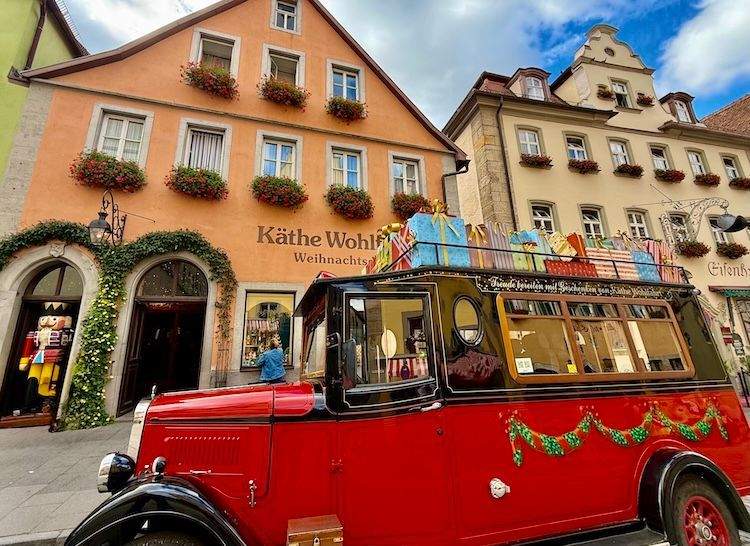 Exterior view of Käthe Wohlfahrt Christmas store in Rothenburg ob der Tauber, known for attracting international visitors with its holiday decorations and ornaments.