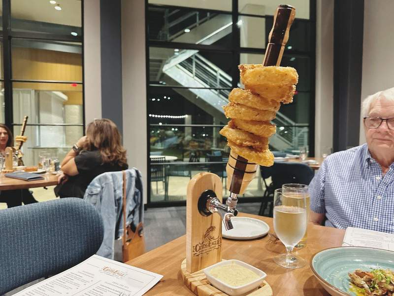 Onion Rings on Tap at Crying Eagle in Lake Charles, LA.  The onion rings were stacked about six inches high.