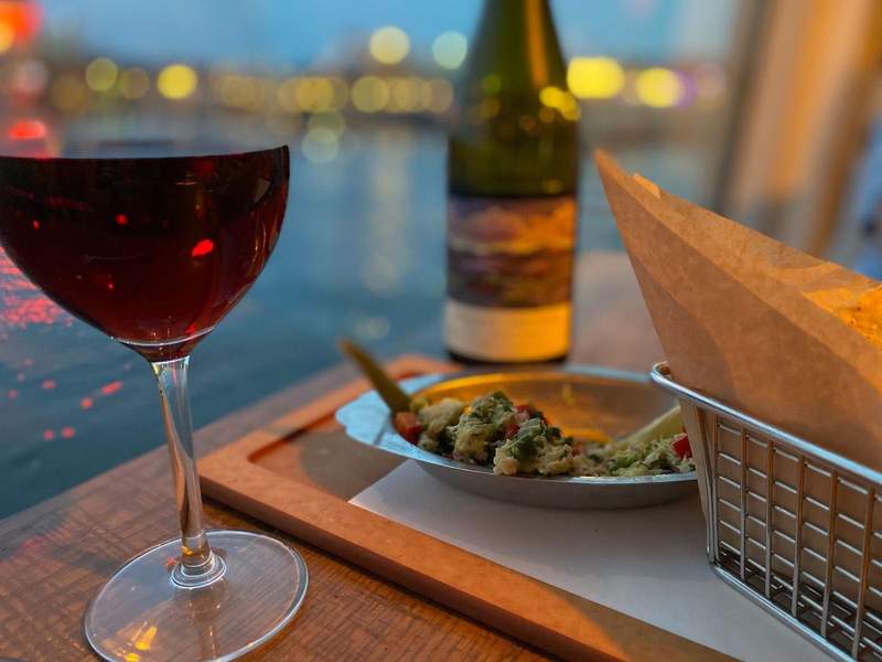 wine and guacamole by the water at Paddlefish in Disney Springs